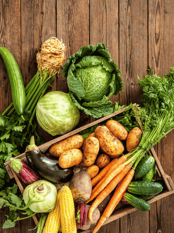 Selection of vegetables on a wooden table top