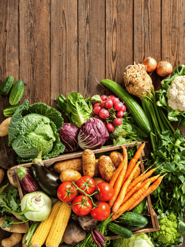 Selection of vegetables on a wooden table top