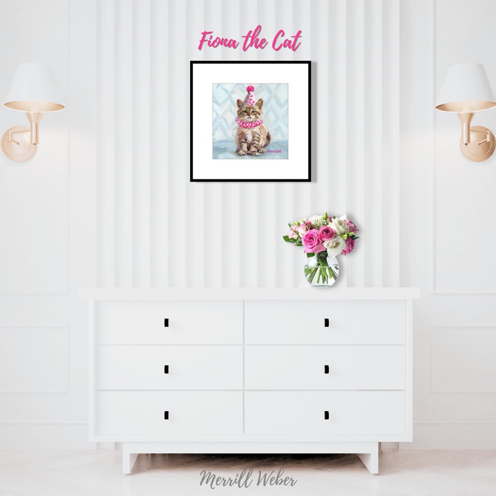 Fiona the Cat framed fine art print styled in a bedroom on a white dresser with pink flowers, cat wall art by Merrill Weber