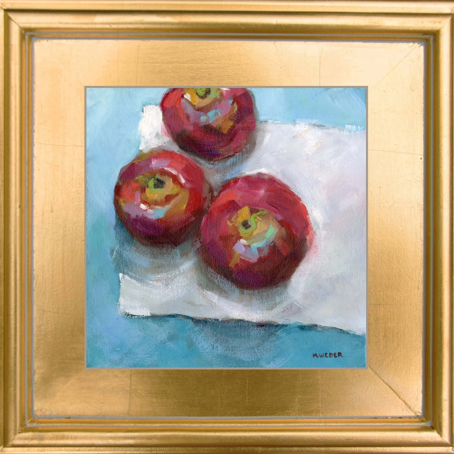 Three Apples original oil painting by Merrill Weber, red apples on white cloth with blue background, expressive brushwork, gold plein air frame, 12x12 still life