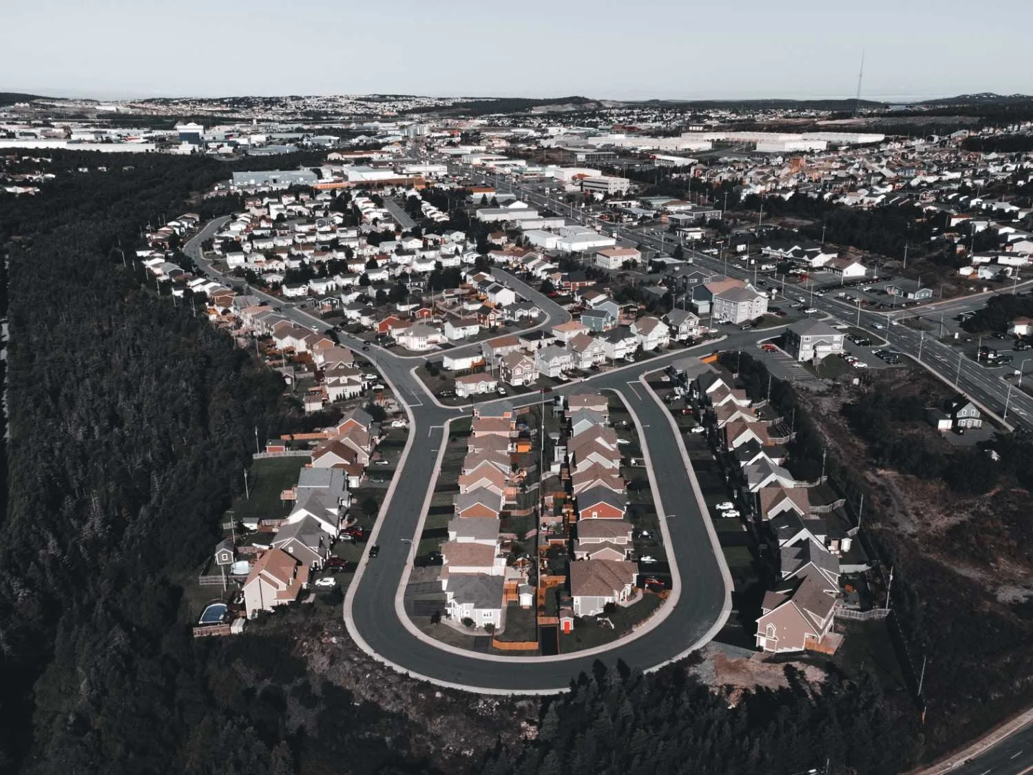 Aerial view of a diverse residential community and surrounding neighborhood.