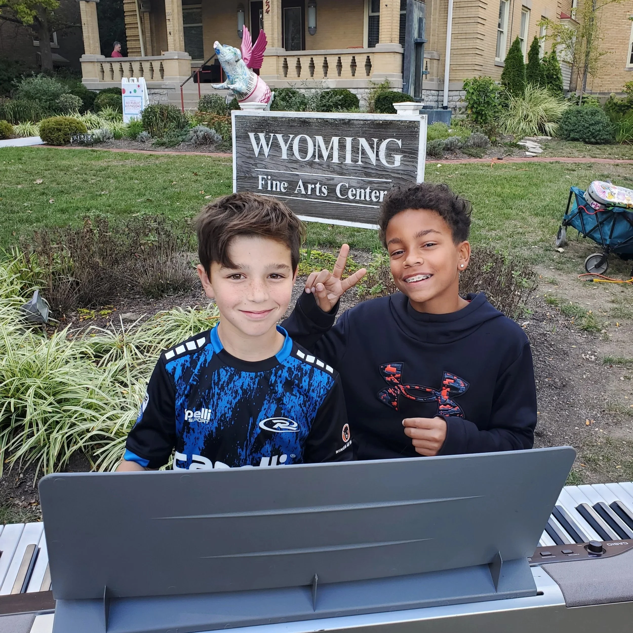 Copy of 10.7.23 fallfest local boys participate in instrument petting zoo.jpg