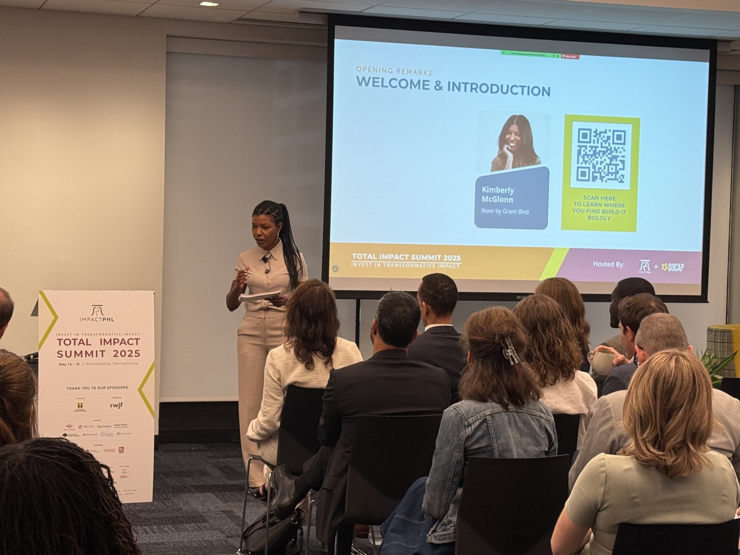 Kimberly McGlonn speaking at the Total Impact Summit 2025 in Philadelphia