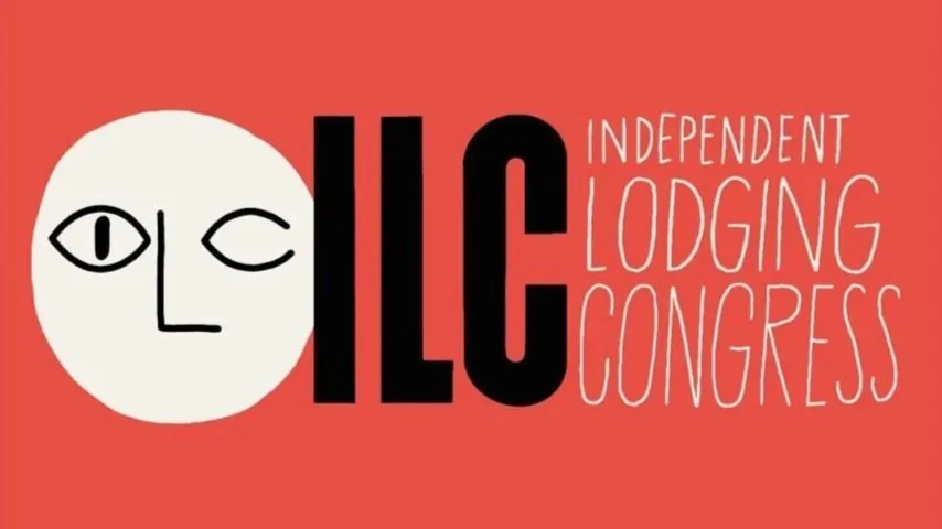Logo for the Independent Lodging Congress featuring a stylized face made with simple black lines inside a white circle, followed by the acronym 'ILC' in bold black letters, and the words 'Independent Lodging Congress' in white text on a red background.