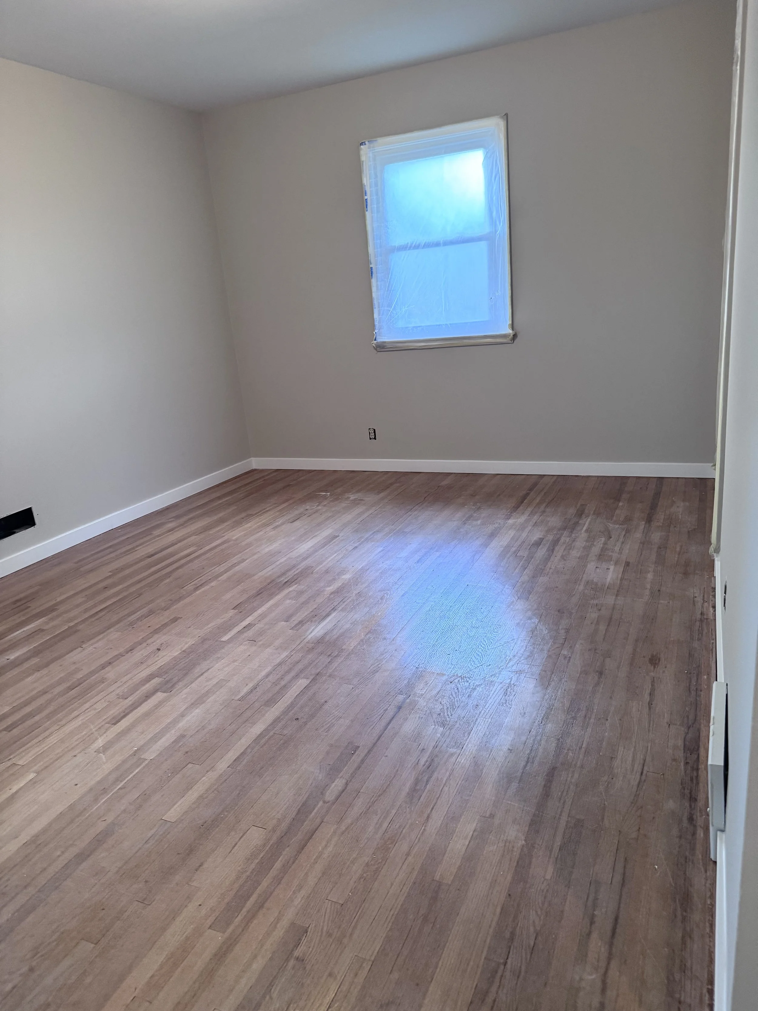 master bedroom view worn floors.jpeg