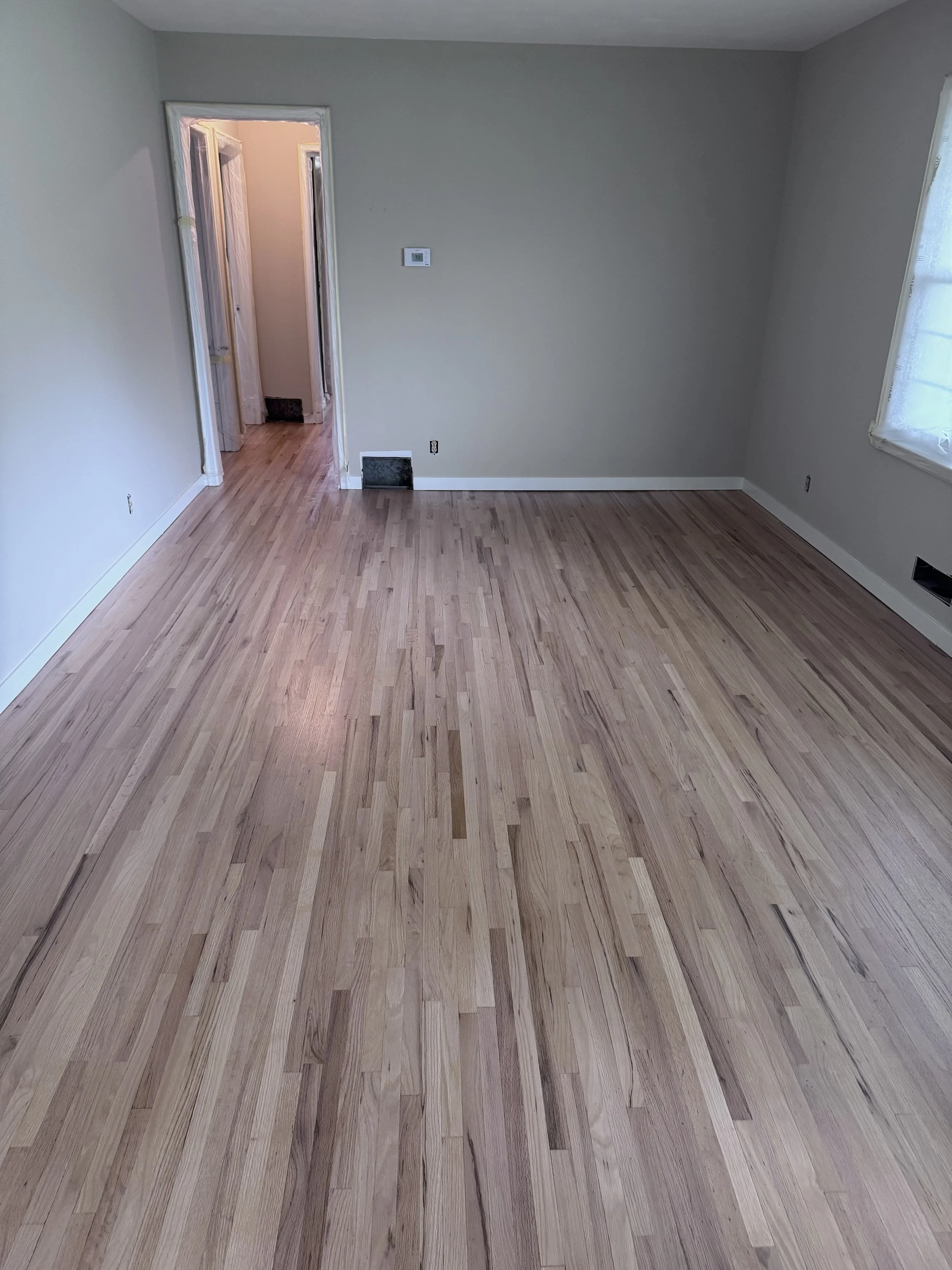 refinished living room floor.jpeg