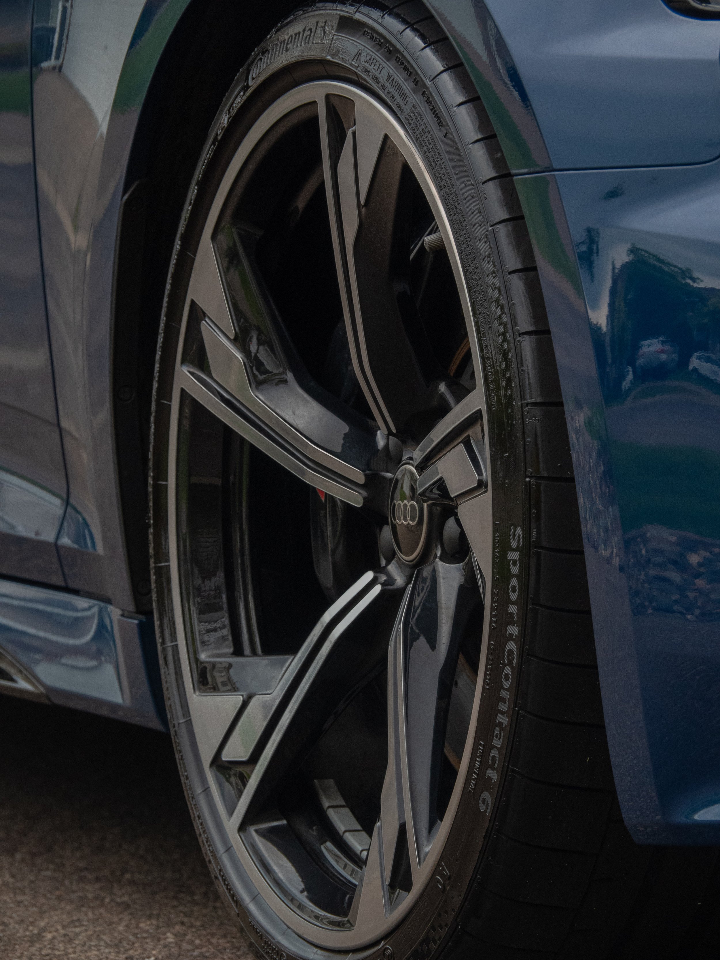 Close-up of an Audi car wheel with a Continental SportContact 6 tire.