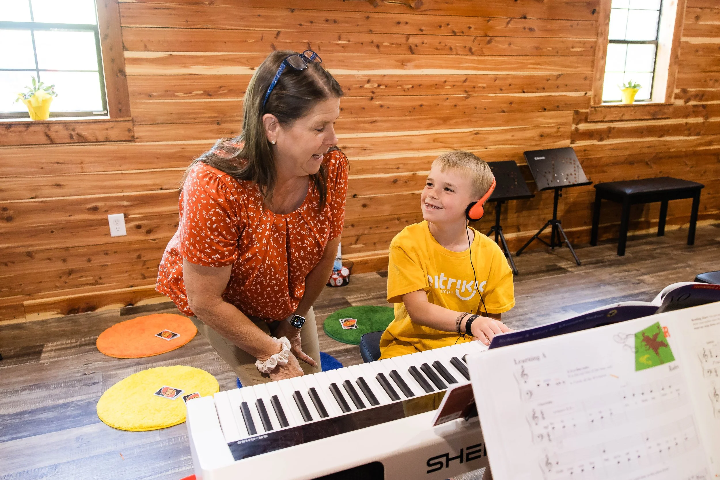 pleased piano student and teacher