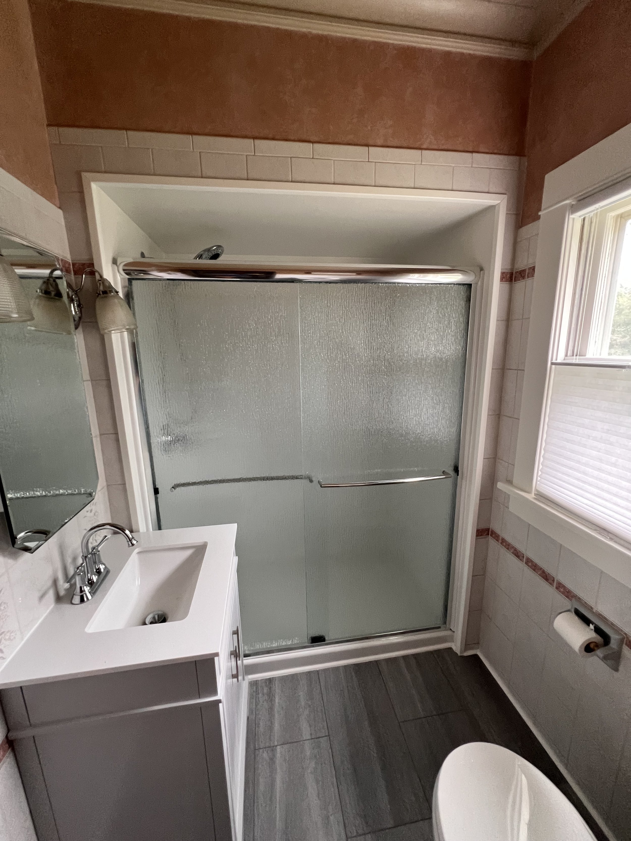 ACRYLIC SHOWER AND SURROUND WITH GLASS DOORS. WHILE SAVING EXISTING TILE