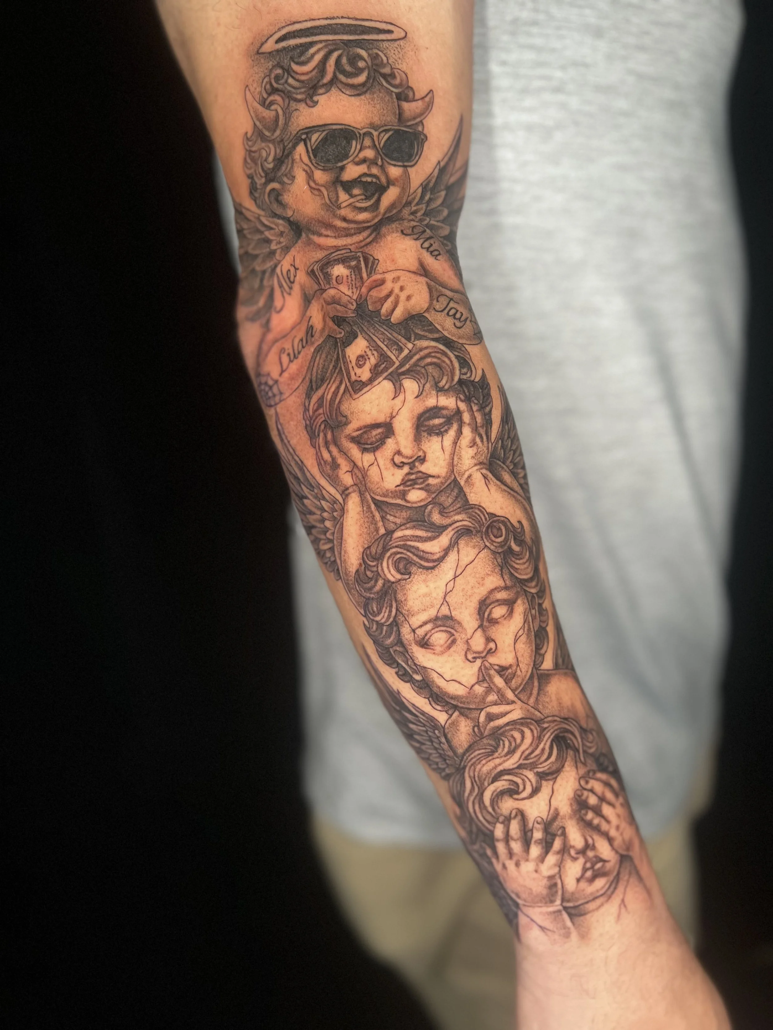 Tattoo of a girl with long hair and tears, holding her head with both hands.
