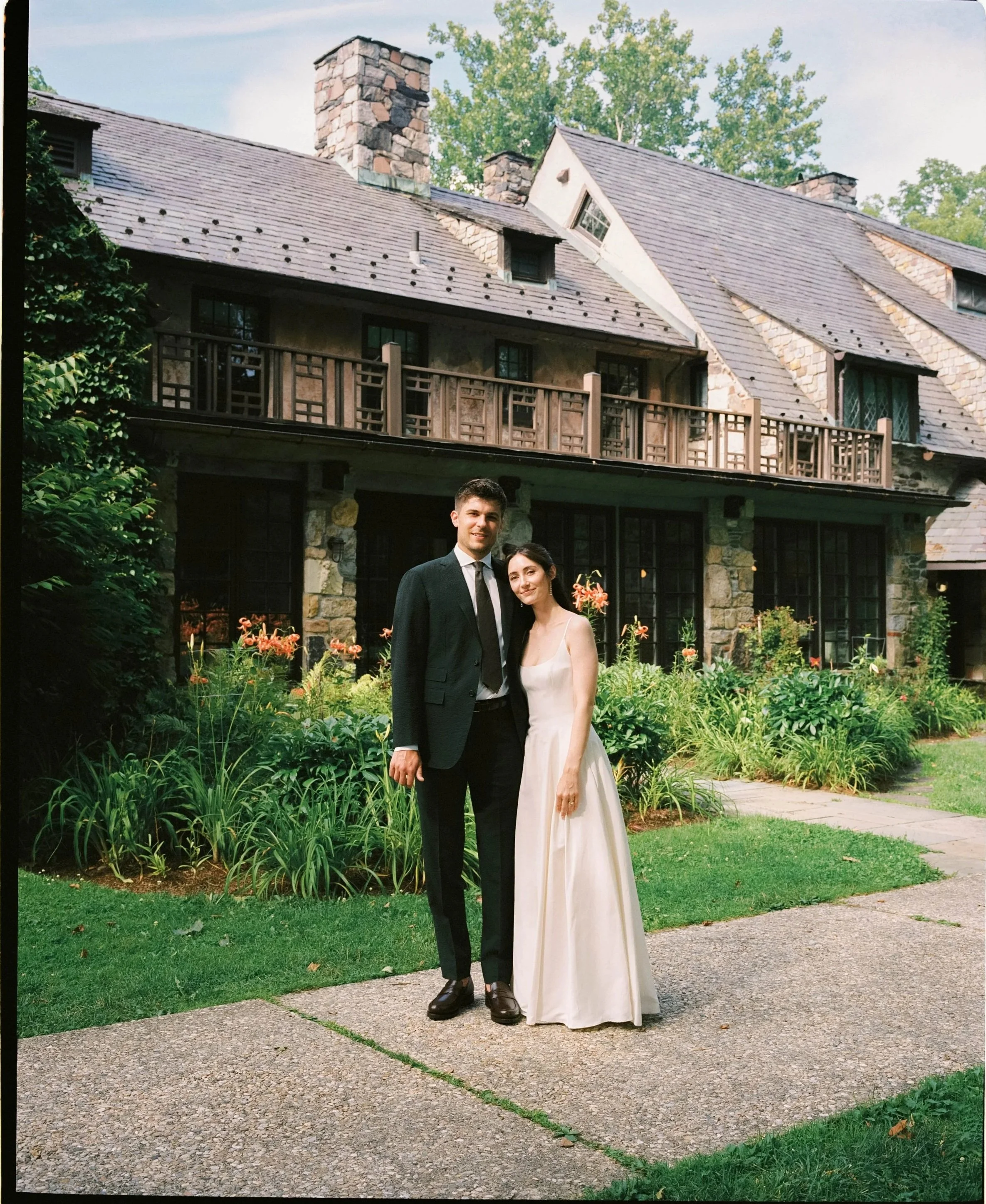 A couple's portrait on color film, getting married at Troutbeck in Amenia, New York
