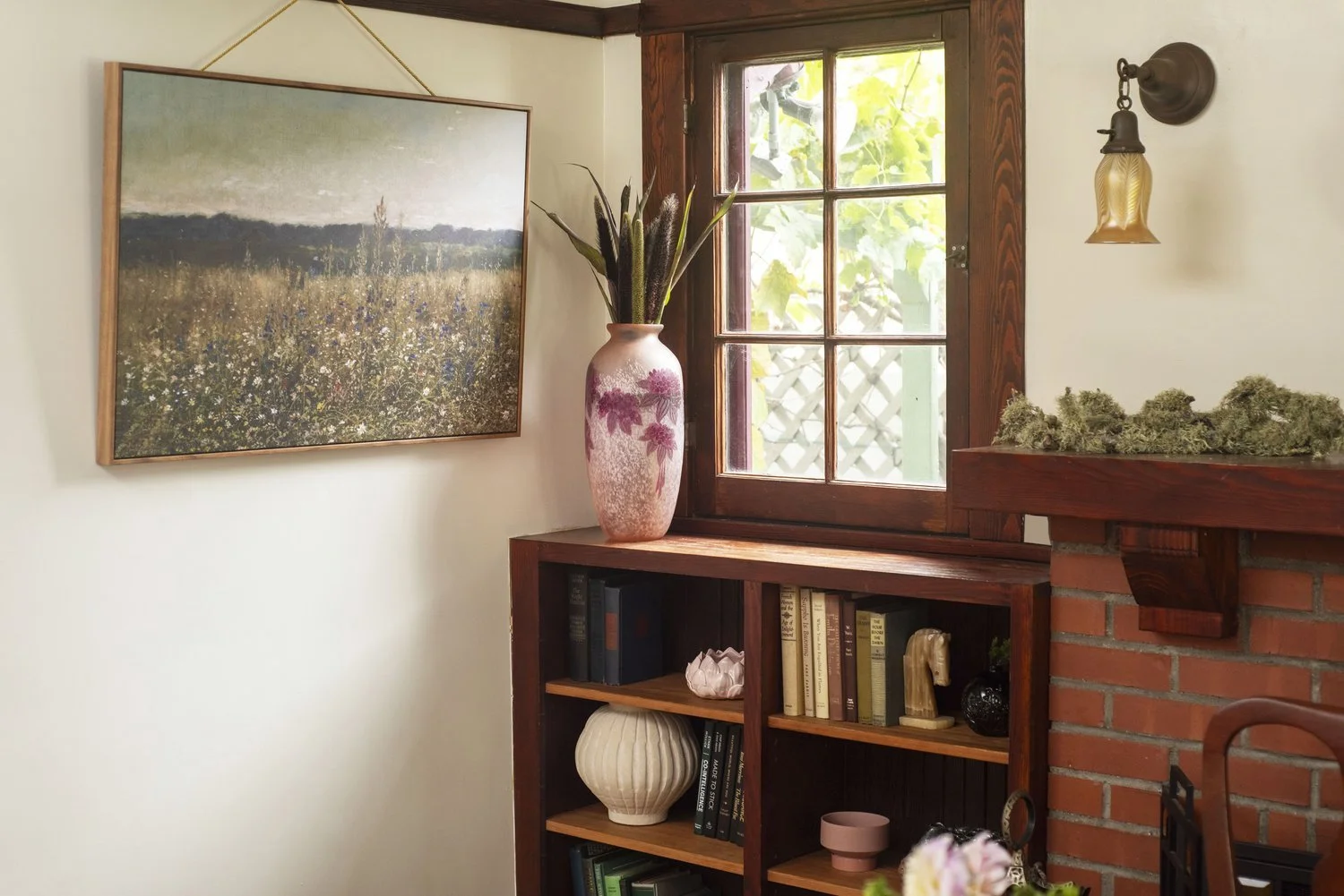 Photo by: Steven Dewall
Nature-inspired forms and imagery permeate the dining room bookshelves through a series of new and vintage objects.