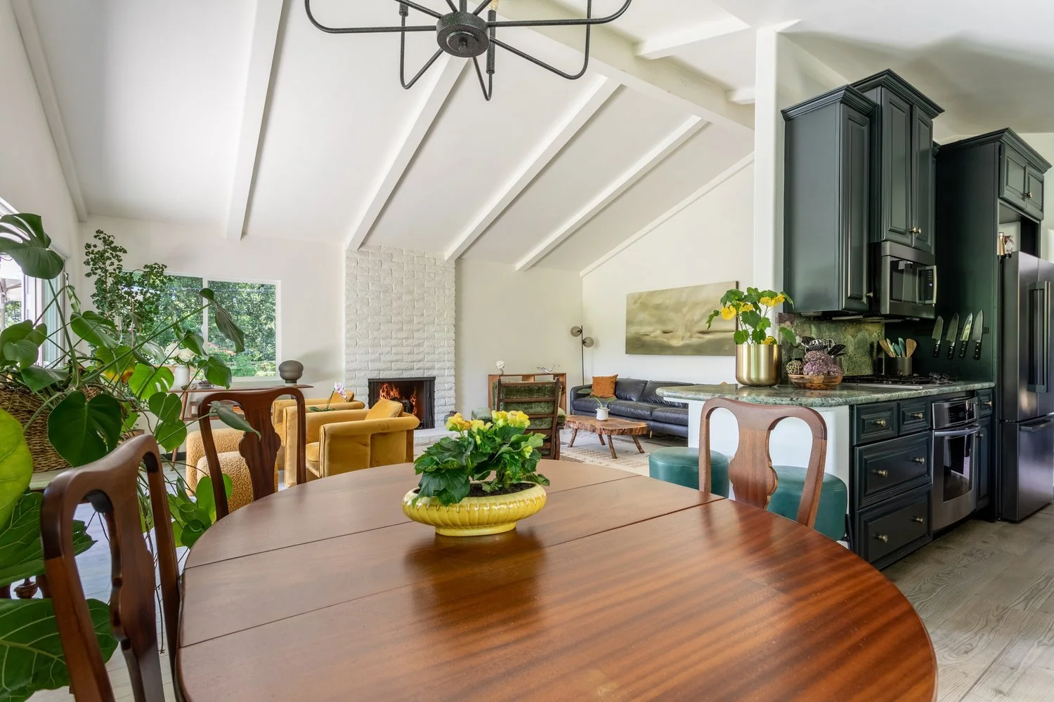 Photo by: Ace Misiunas
The dining area features a restored mahogany dining table that has been in the family for generations. This antique table features a central column base with claw feet and Queen Ann dining chairs with a ball and claw feet. A ye