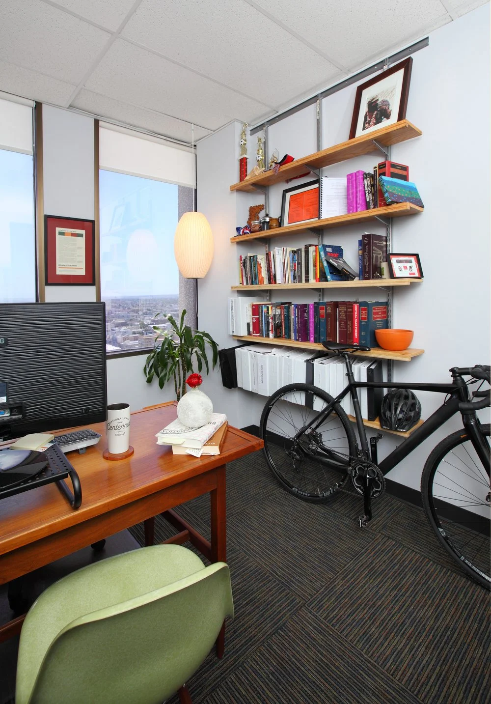 Photo by: Chas Metivier
A donated mid-century desk pairs well with the recycled carpet tiles and vintage lighting. 