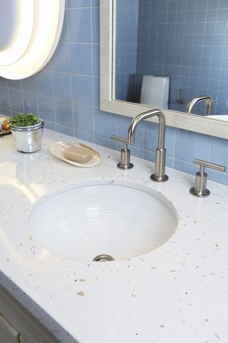Photo by: Chas Metivier
Quartz countertops infused with real seashells pair nicely with the oceanside location of the residence.