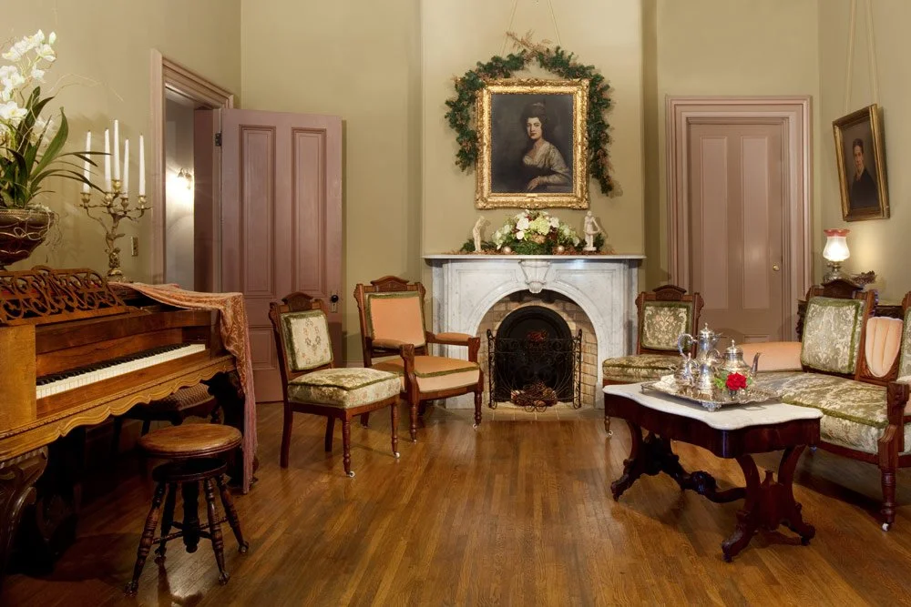 Photo by: Brad Nicol
An antique American walnut parlor set is paired with a Victorian marble coffee table on casters.