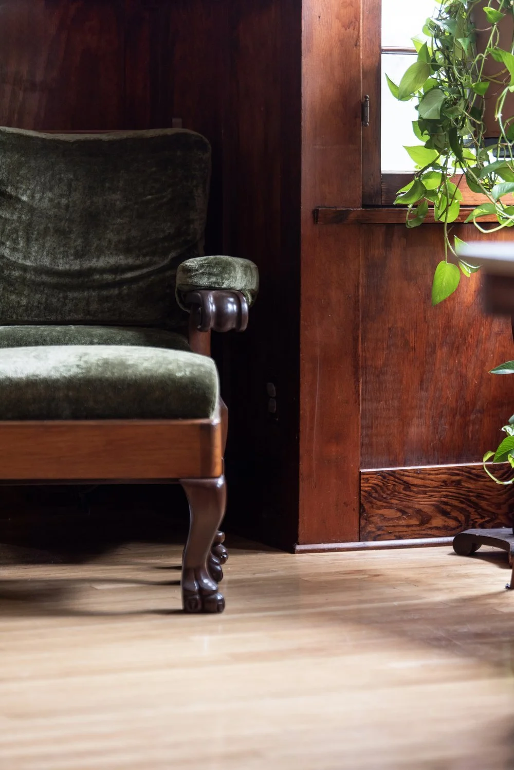 Photo by: Steven Dewall
This restored antique armchair was reupholstered with deep green linen velvet, whose soft and varied texture compliments the armchair's antique quality, alongside a custom-made matching ottoman.