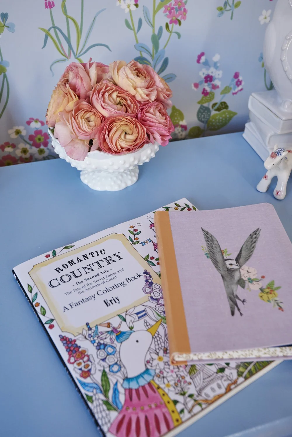 Photo by: Steven Dewall
Vintage hobnail milk glass and pretty pink ranunculus add a delicate beauty to this little girl's desk. 