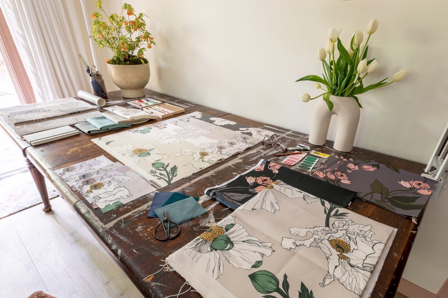 Photo by: Ace Misiunas
Textile samples from Kale Tree cover this vintage work table.