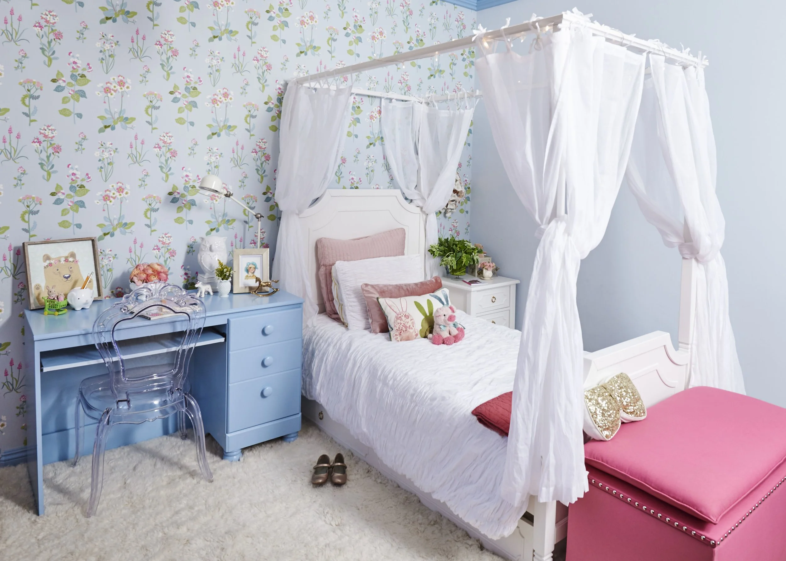 Photo by: Steven Dewall
A little girl's bedroom in pink, pale blue and grass green. The fuchsia bench tucks away toys and blankets with hidden storage. 