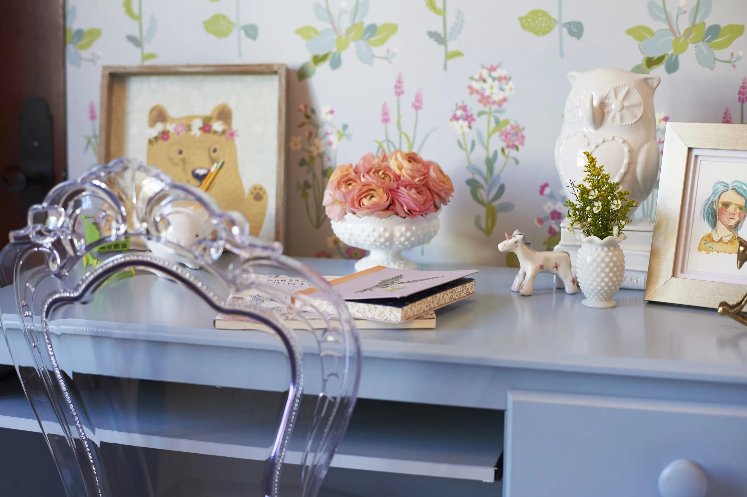 Photo by: Steven Dewall
A delightfully delicate clear Lucite chair adds a feminine whimsy to the pale blue desk. 