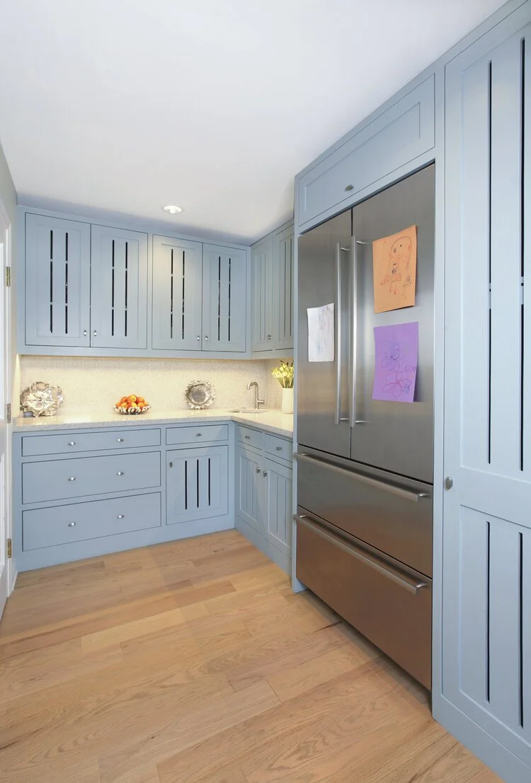 Photo by: Chas Metivier
The adjacent pantry provides ample storage for utility items as well as a plethora of arts and crafts supplies for the homeowner’s young child. The refrigerator serves as an art gallery with rotating household exhibitions.