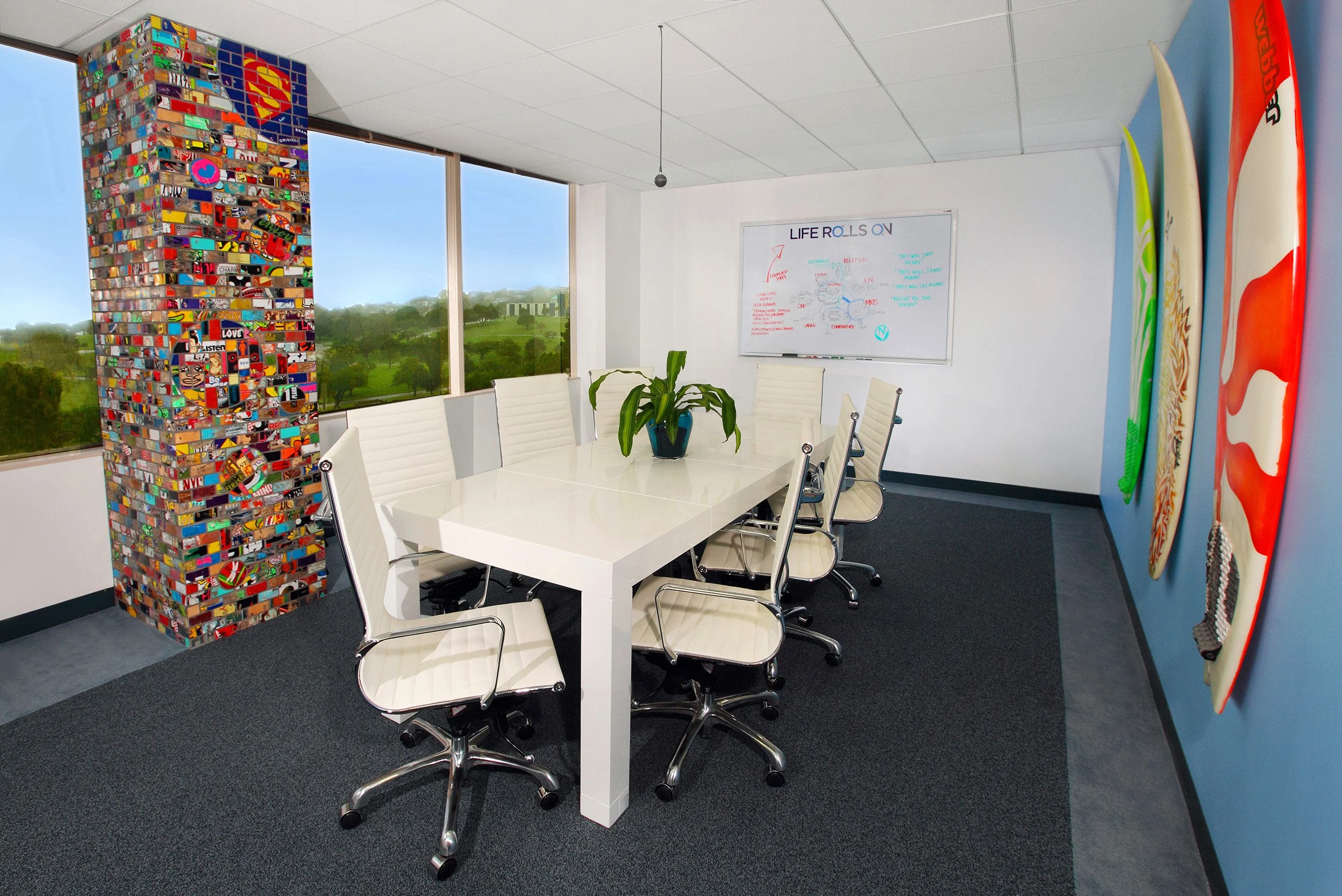 Photo by: Chas Metivier
Surfboards painted by youthful members of LRO add interest to the conference room as works of art.