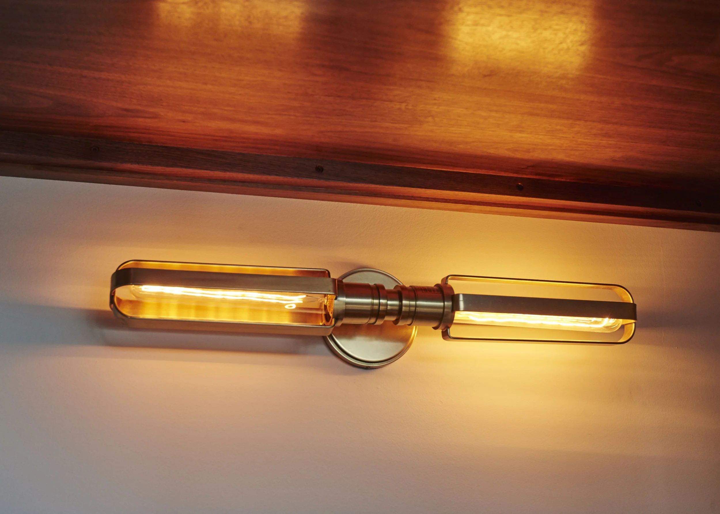 Photo by: Steven Dewall
Antique brass wall sconces are tucked inside of each boy's bunk so that reading in bed is cool and convenient.