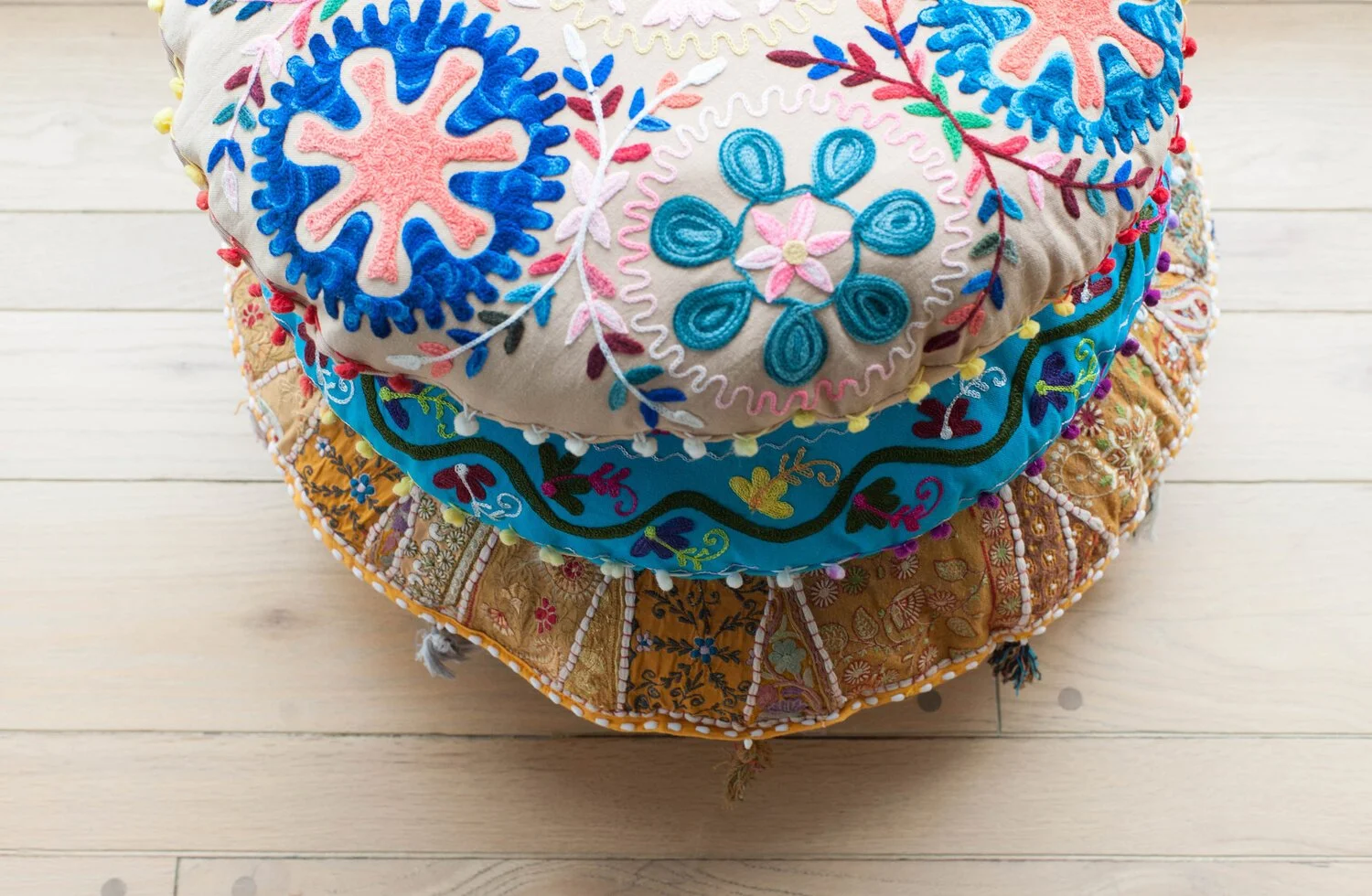 Photo by: Steven Dewall
A collection of brightly colored floor cushions provides the perfect casual living room seating.