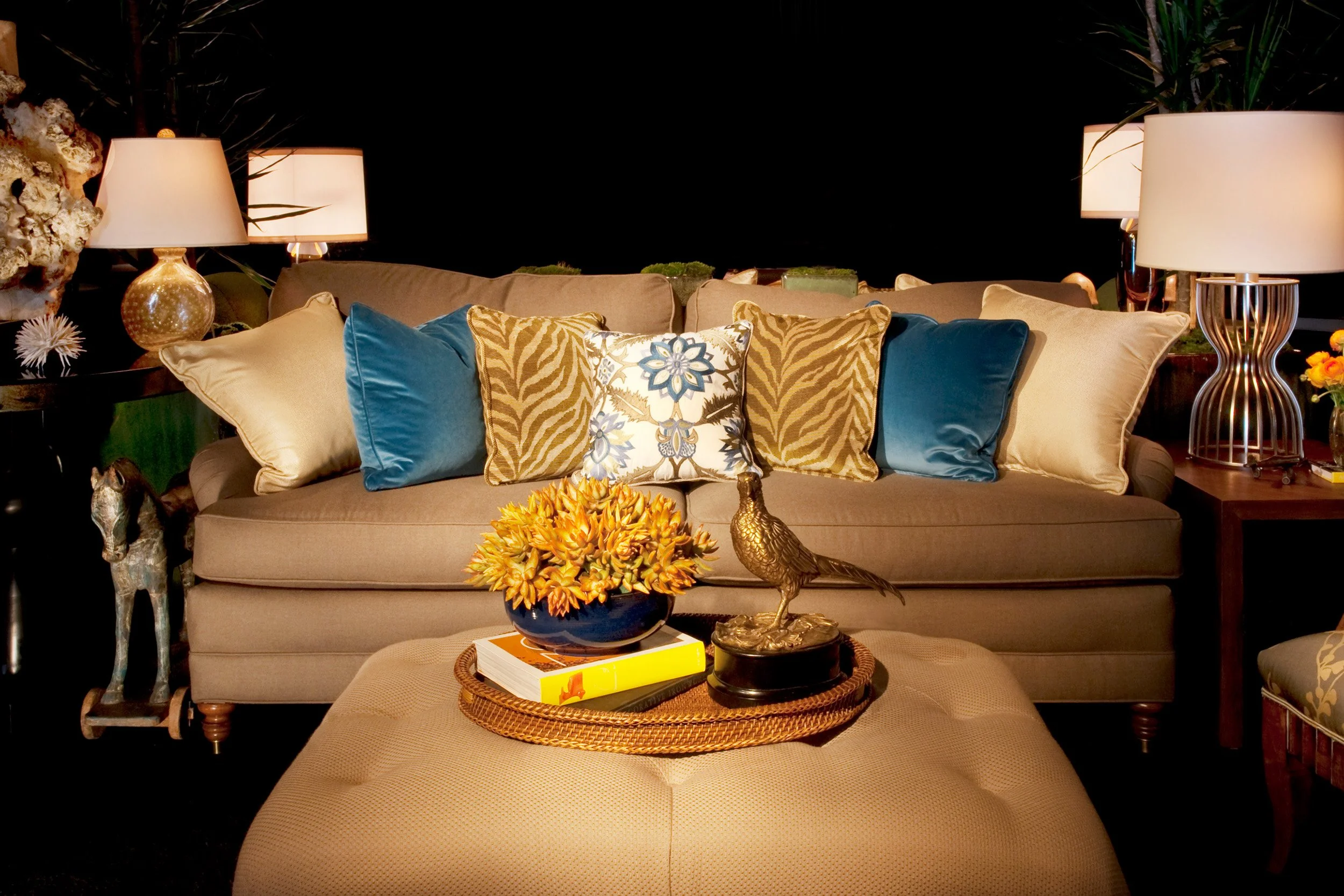 Photo by: Brad Nicol
A sofa outfitted in menswear woolens in paired with sophisticated lamps and an antique wooden horse.