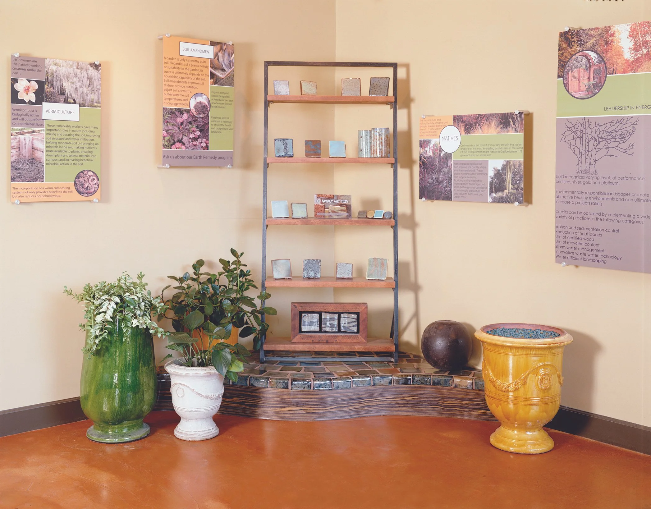 Photo by: Charlie Daniels
A salon display is created with reclaimed wood, steel, and hand-painted tiles to embody and showcase the Environmental Concept mission.