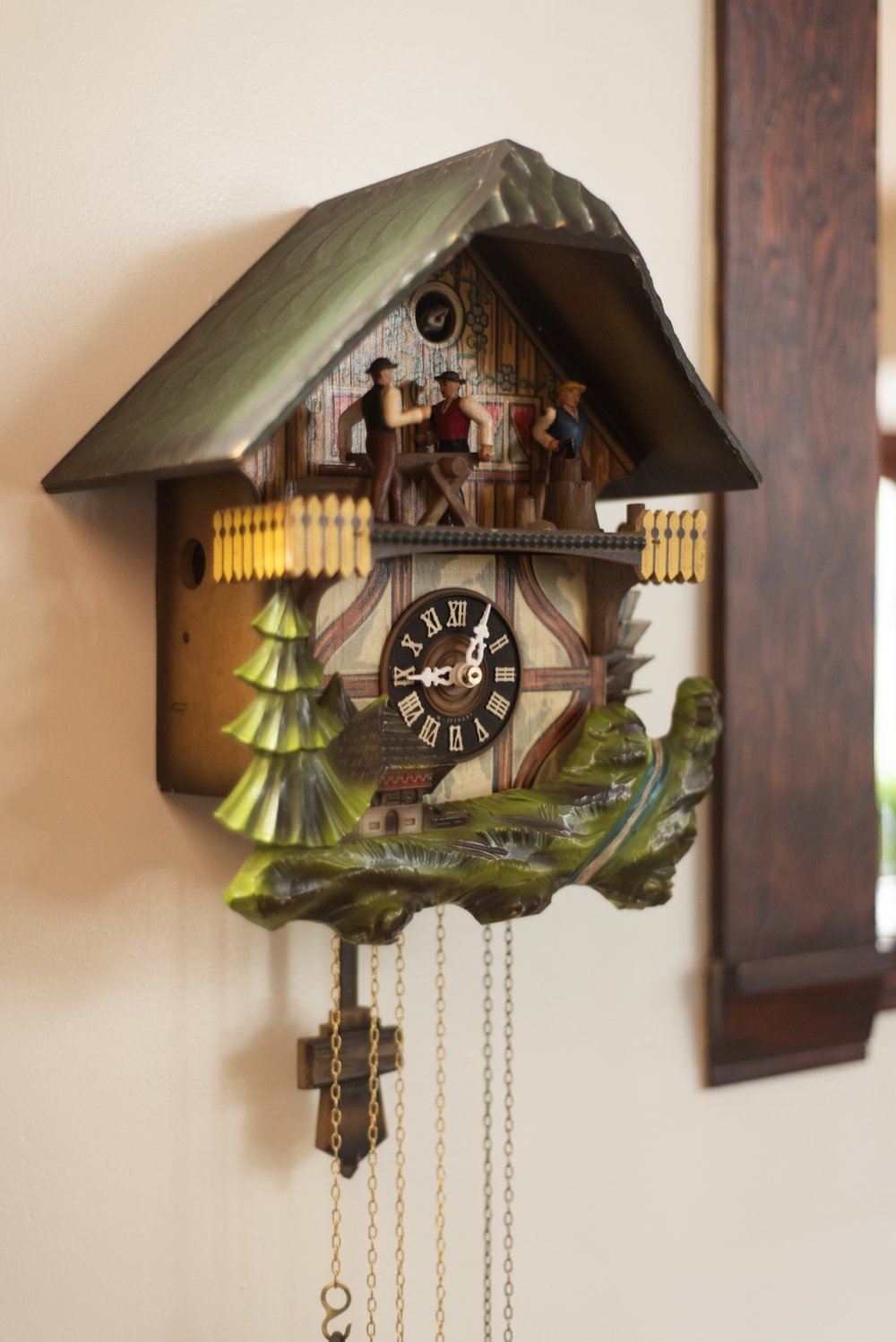 Photo by: Steven Dewall
This recently restored cuckoo clock in the living room entryway depicts a sculptural nature scene.