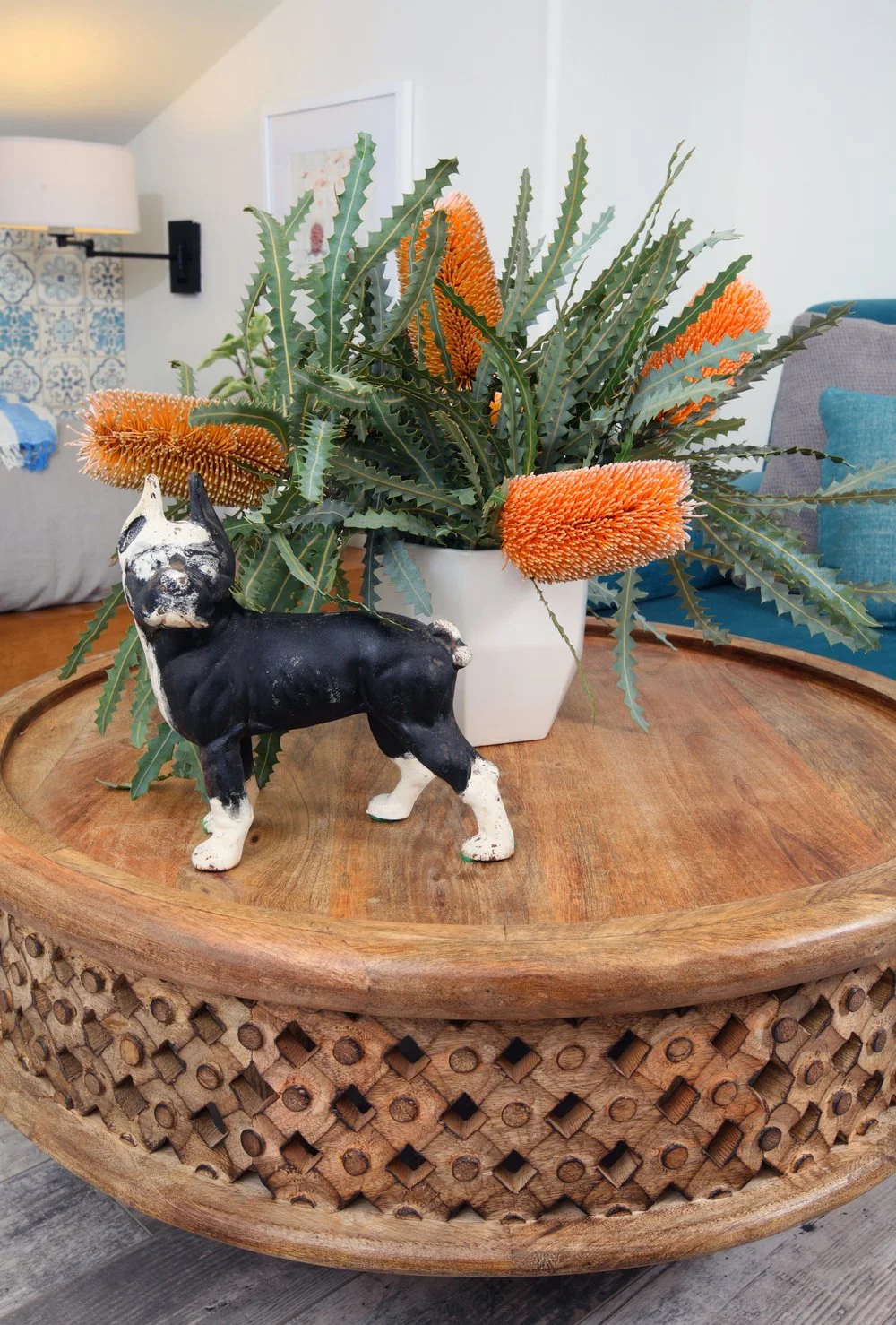 Photo by: Chas Metivier
An antique iron doorstop rests on the carved mango wood coffee table.