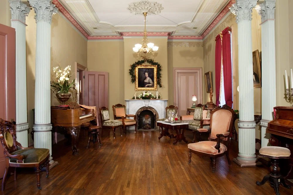 Photo by: Brad Nicol
A grand Italianate ballroom separated by pairs of Corinthian columns is delightfully dressed in shades of pink and green.
