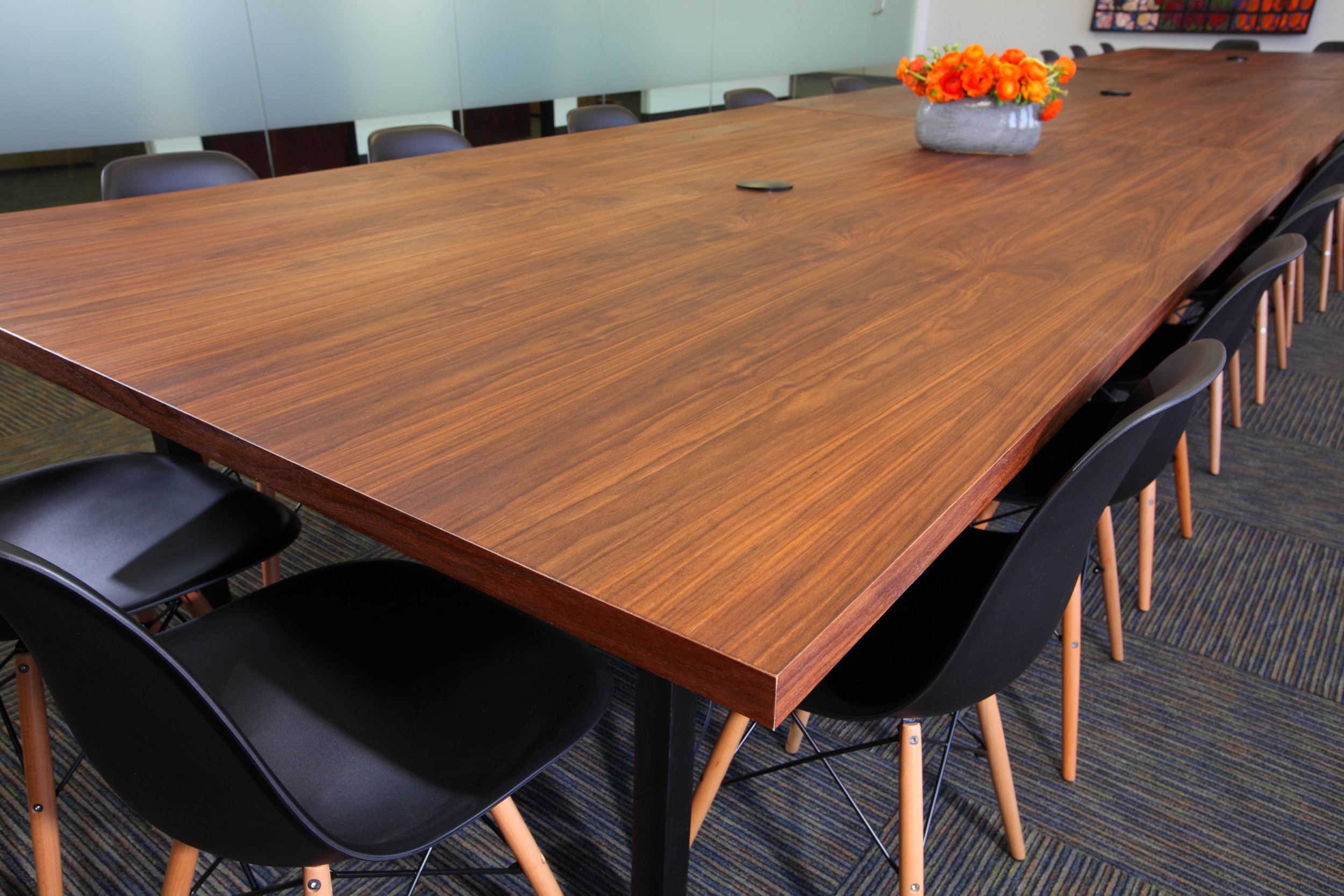 Photo by: Chas Metivier
The walnut plywood conference room was custom made to accommodate ever changing staff needs and can be arranged in several different configurations. 