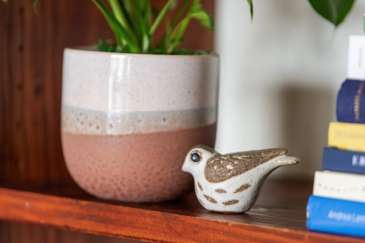 Photo by: Steven Dewall
This vintage ceramic wren made from stoneware presents a stylized representation of a bird within this collection of bird figurines.