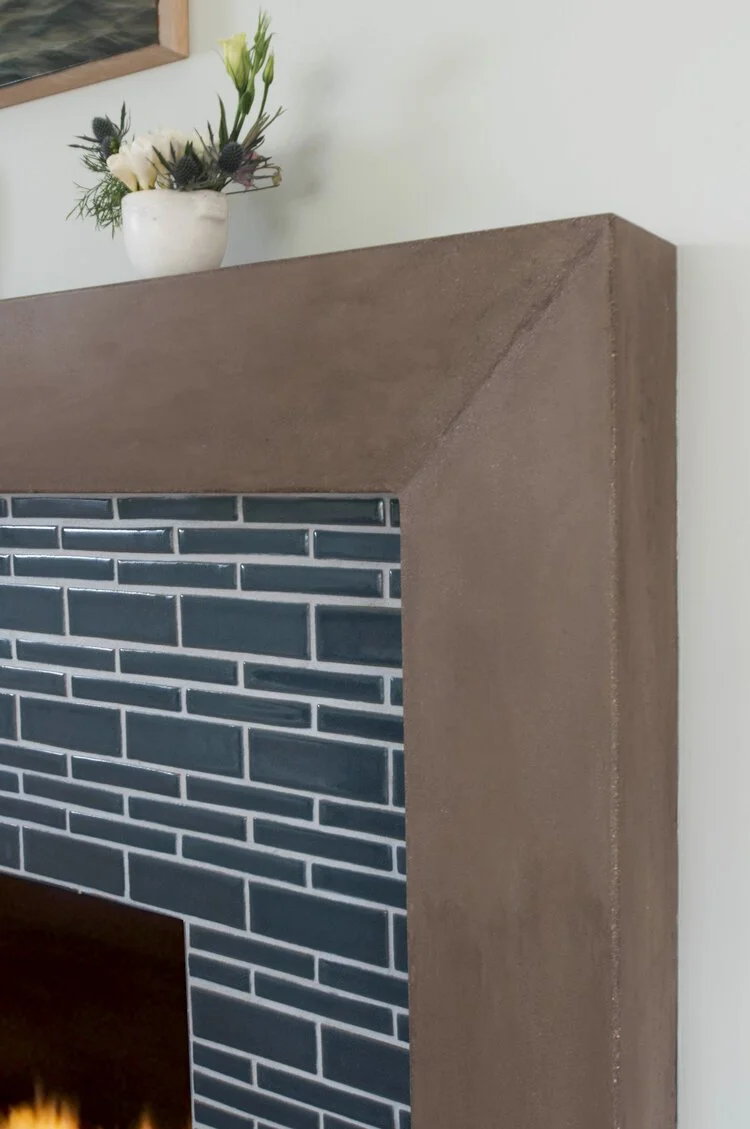 Photo by: Steven Dewall
The fireplace surround was designed by Sarah Barnard in custom concrete and handmade ceramic tiles.