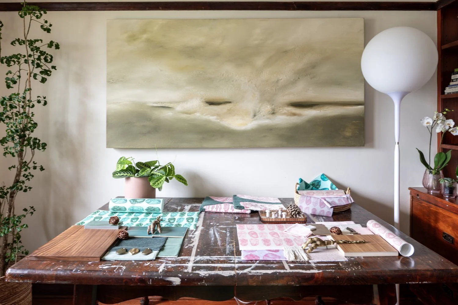Photo by: Steven Dewall
This cherished vintage worktable's well-loved, prominent woodgrain harmonizes with wood flooring, built-in shelving, and cabinetry throughout the room.
