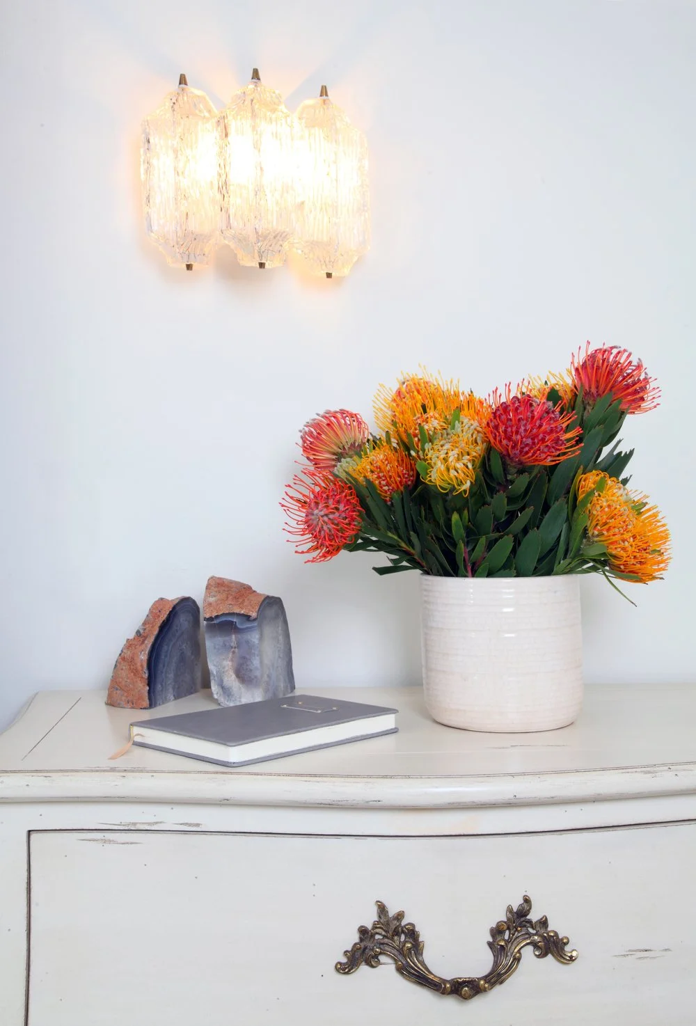 Photo by: Chas Metivier
The vintage Austrian wall sconces (c.1960) add a subtle warmth to the crisp white space.  