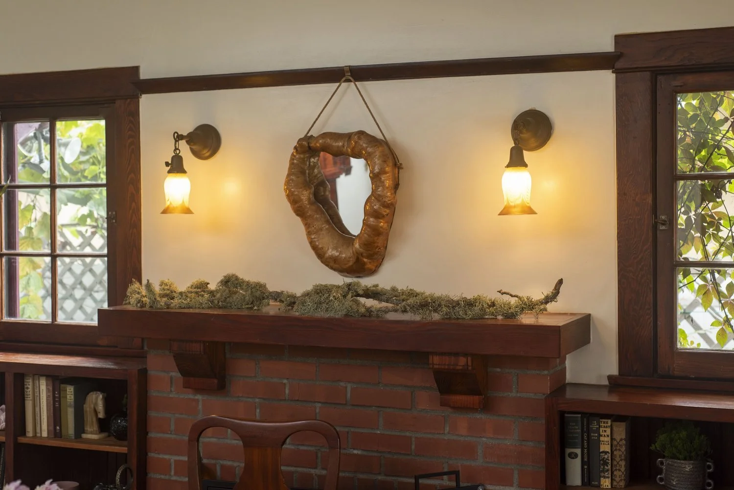 Photo by: Steven Dewall
The sconces on either side of the fireplace mantel were salvaged locally and are estimated to be from 1912 to 1920.