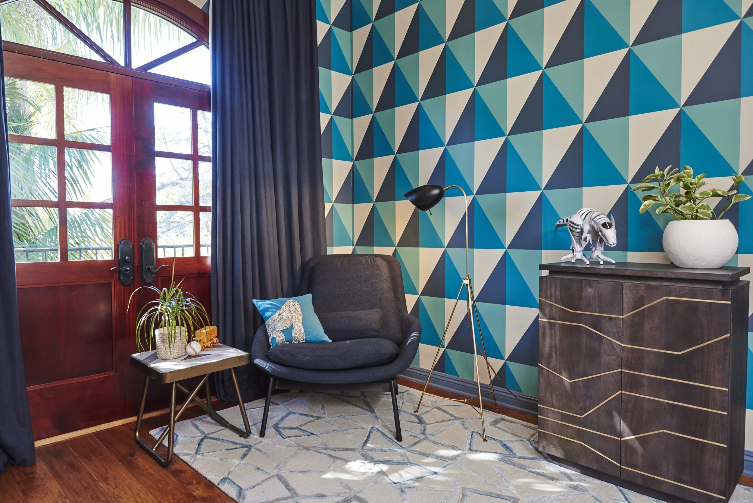 Photo by: Steven Dewall
Geometric wallpaper in navy, teal and oatmeal creates graphic appeal in the boys' bedroom. 