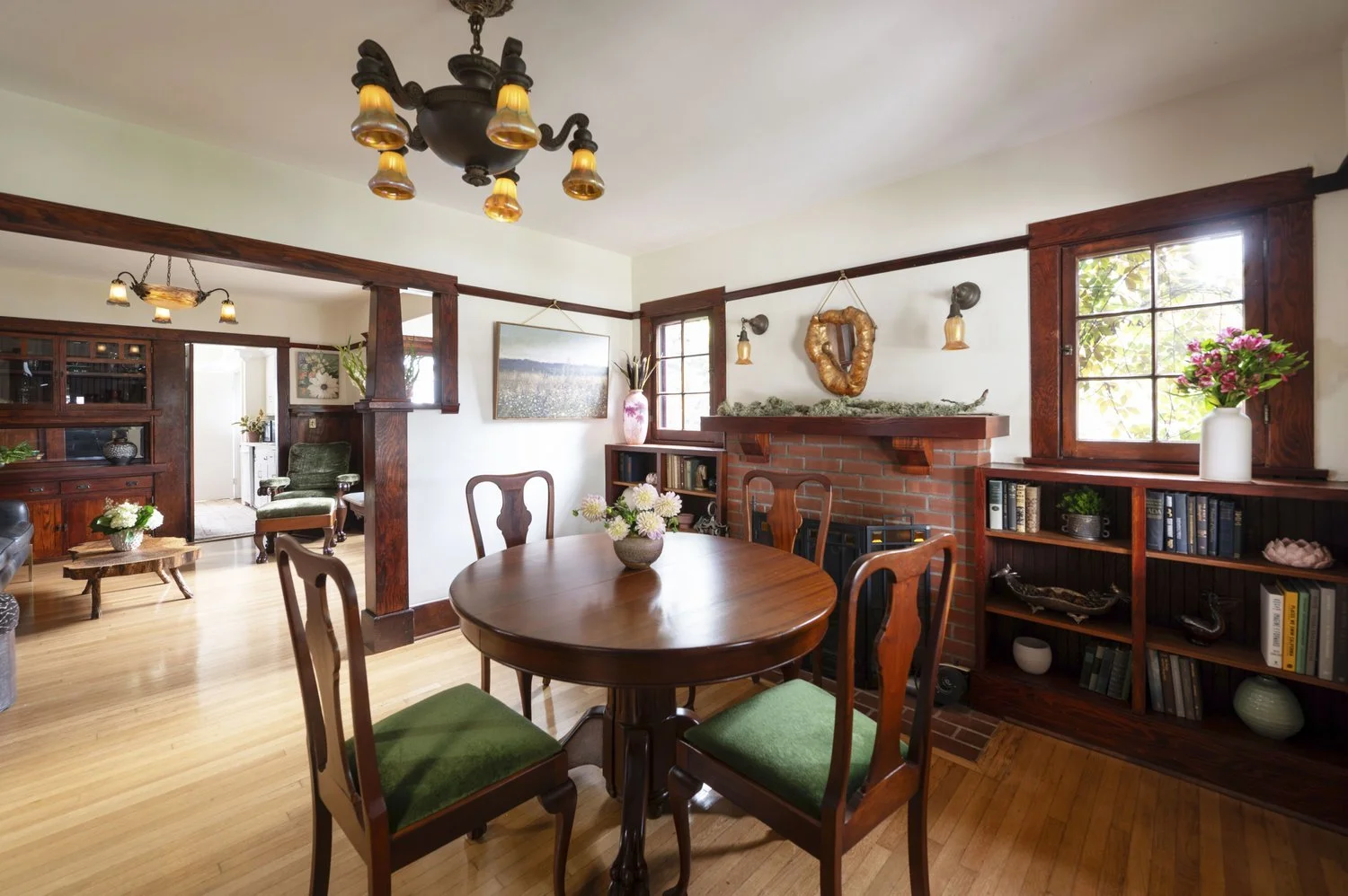 Photo by: Steven Dewall
The chandelier above the dining room table incorporates vintage Quoizel glass shades that emulate the spirit of craftsman style through their resemblance to hanging flowers.