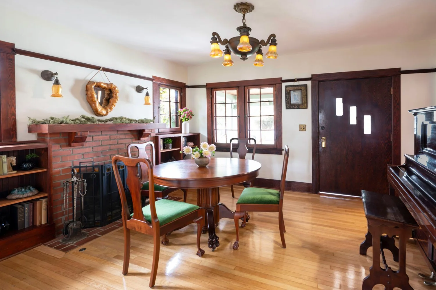 Photo by: Steven Dewall
This dining room features a restored antique Queen Anne-style mahogany dining table from the early 1800s, as well as dining chairs reupholstered in a luxurious green mohair fabric.