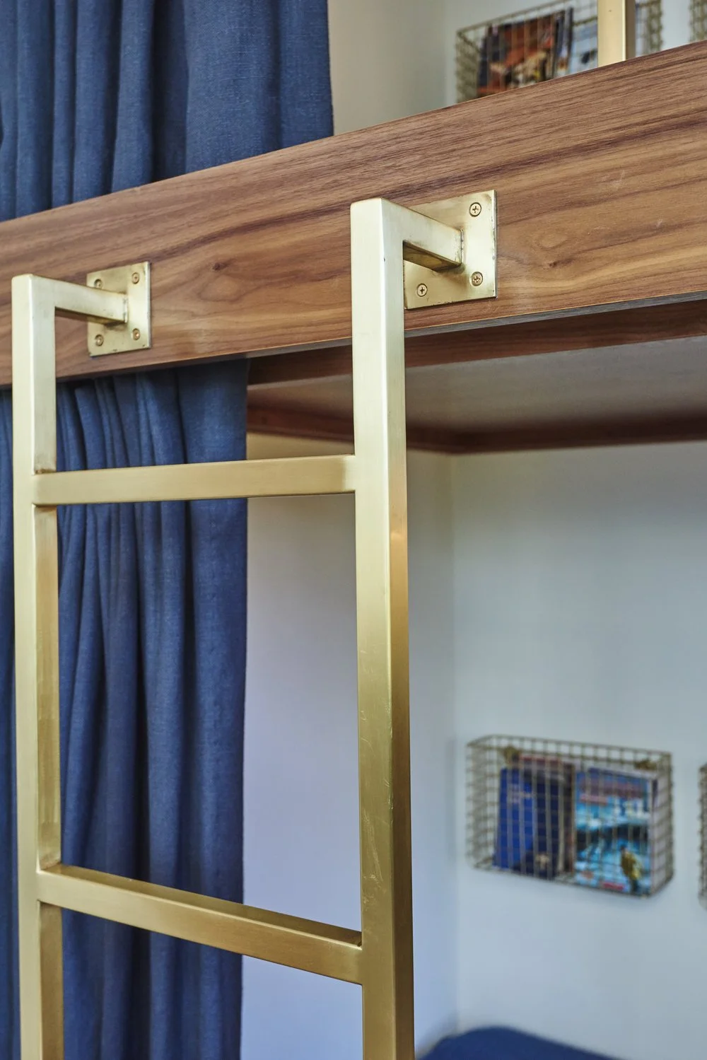 Photo by: Steven Dewall
Sarah Barnard designed the custom brushed brass ladder and bed rail to complement the antique metal finishes throughout the boys' bedroom.