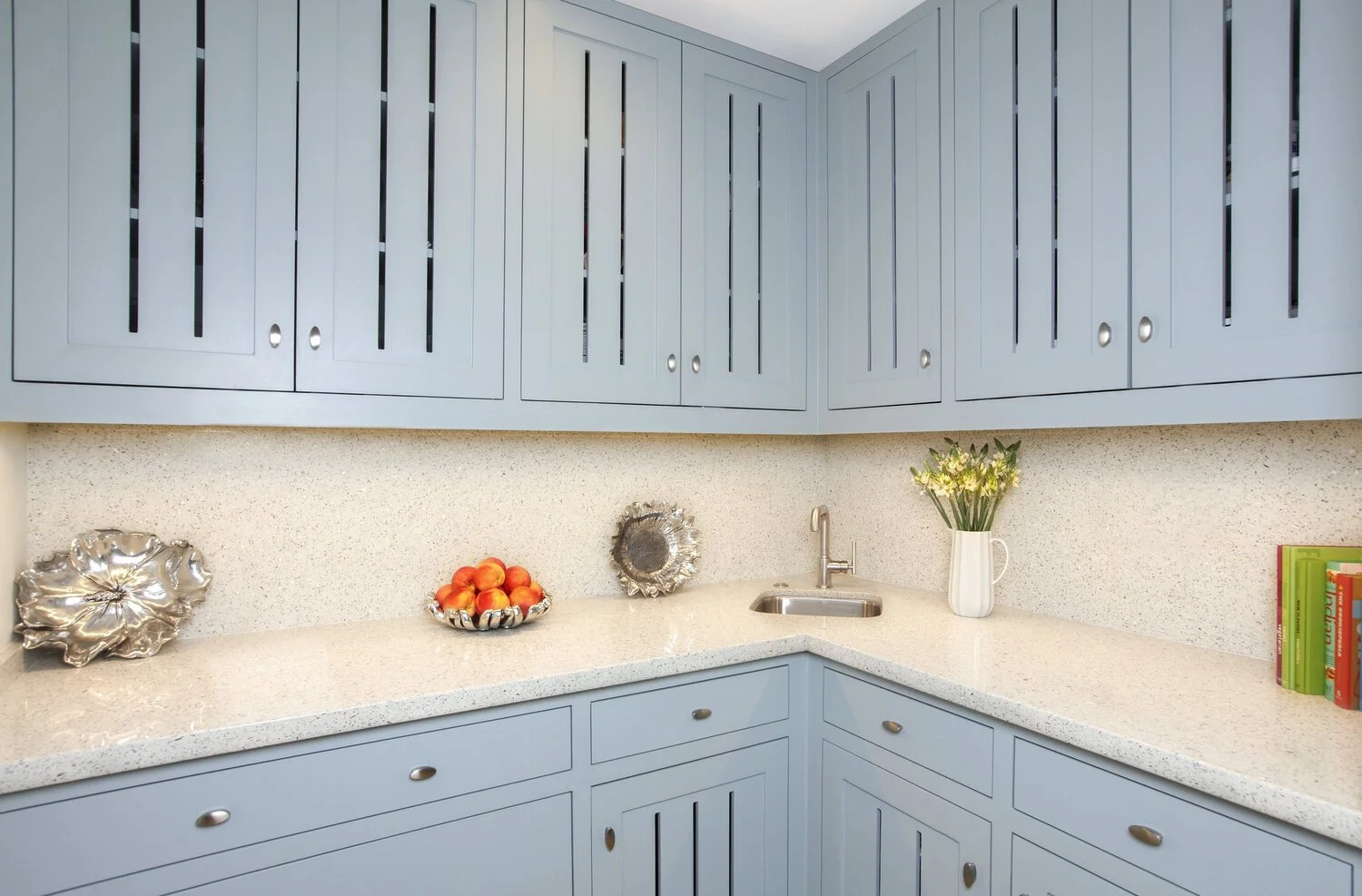 Photo by: Chas Metivier
The quartz countertops shine with flecks of real seashells.