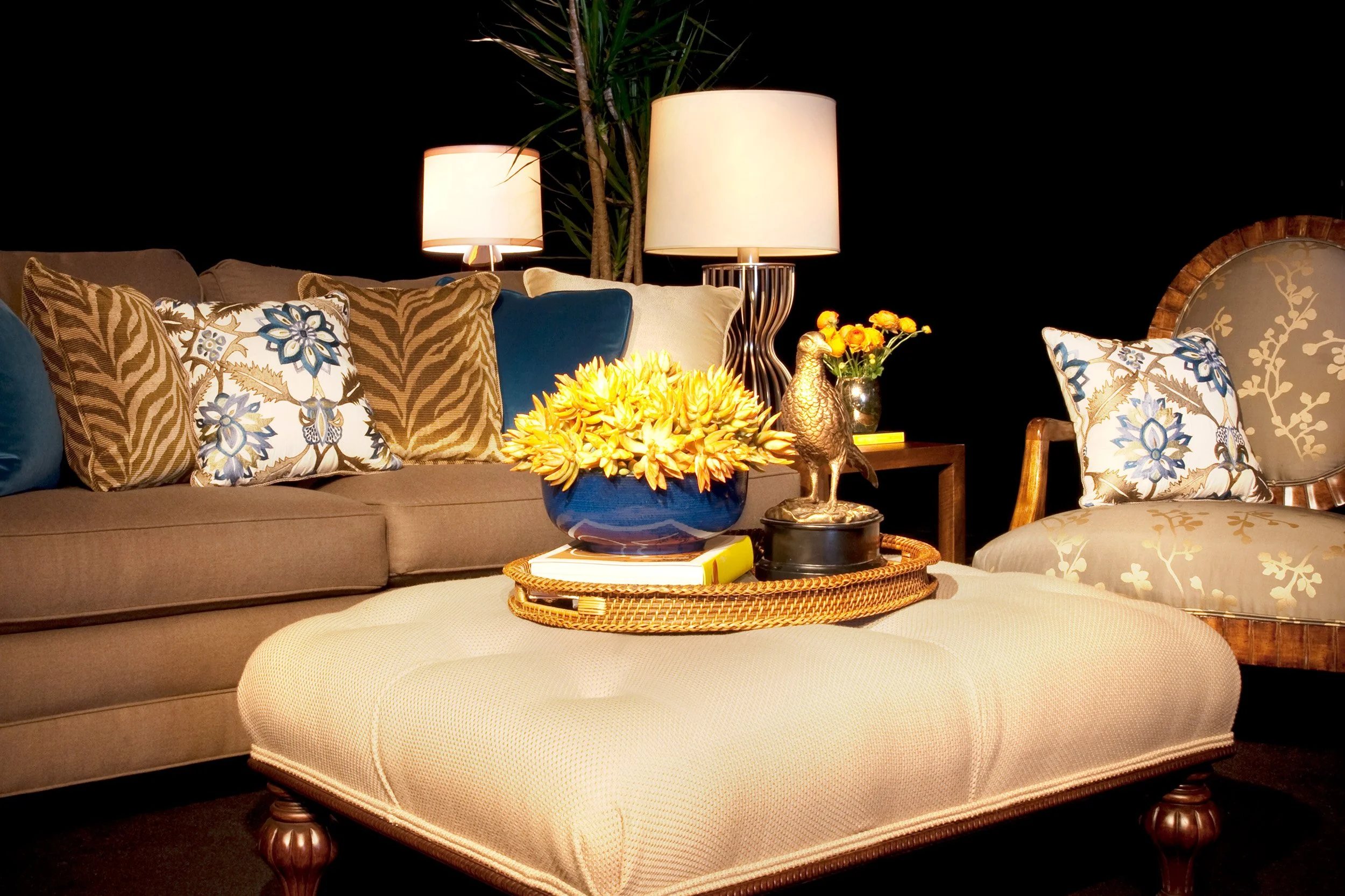 Photo by: Brad Nicol
Potted succulents, fresh renoculous stems, and a bold brass pheasant add interest to the space.