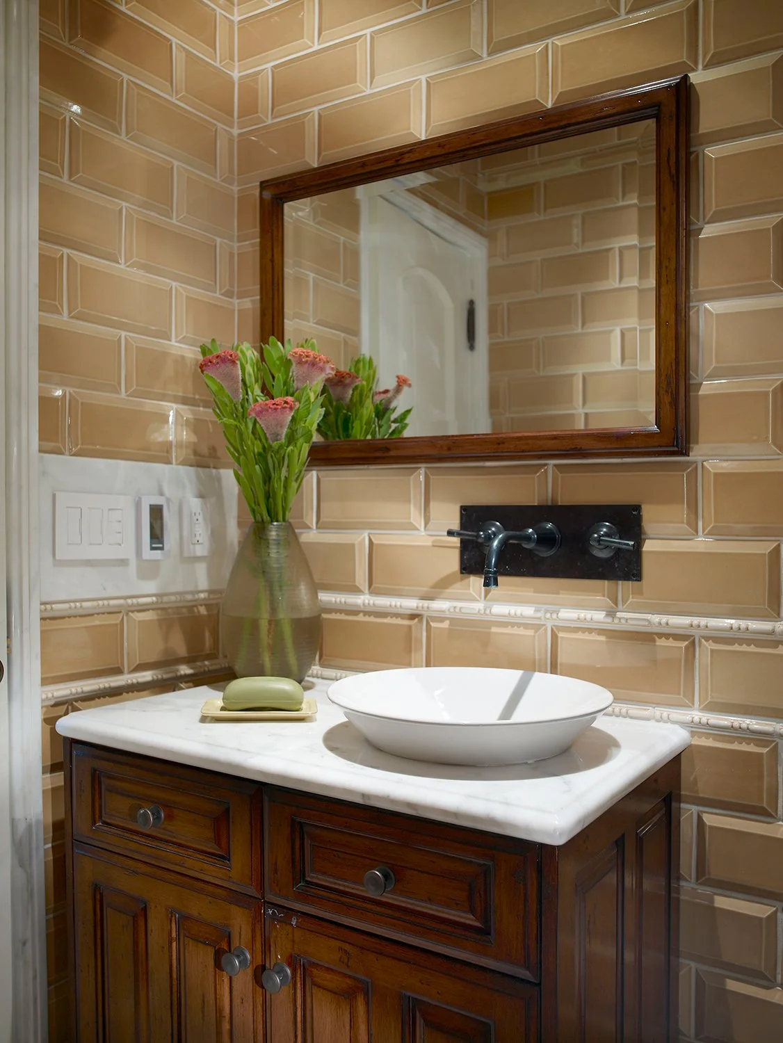 Photo by: Scott Van Dyke
Bespoke cabinetry, carrera marble detailing and oil rubbed bronze fixtures create a rich palette that delight the senses.