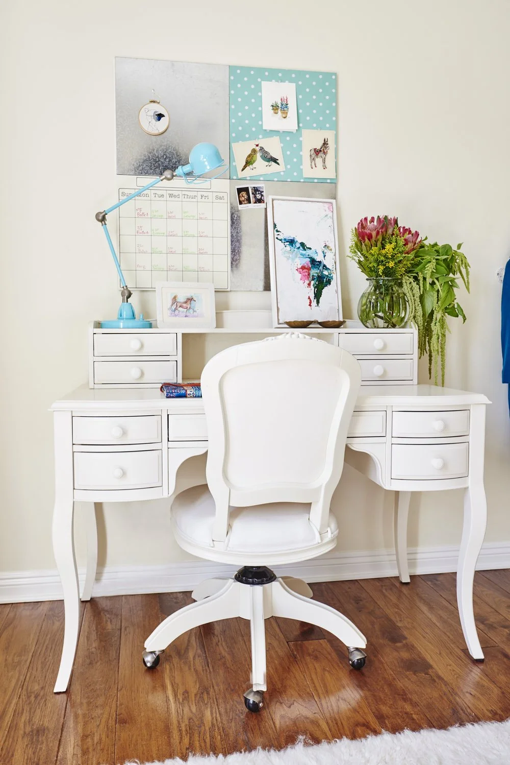 Photo by: Steven Dewall
A desk chair inspired by Queen Anne style pairs perfectly with a vintage inspired desk in a creamy white finish. 