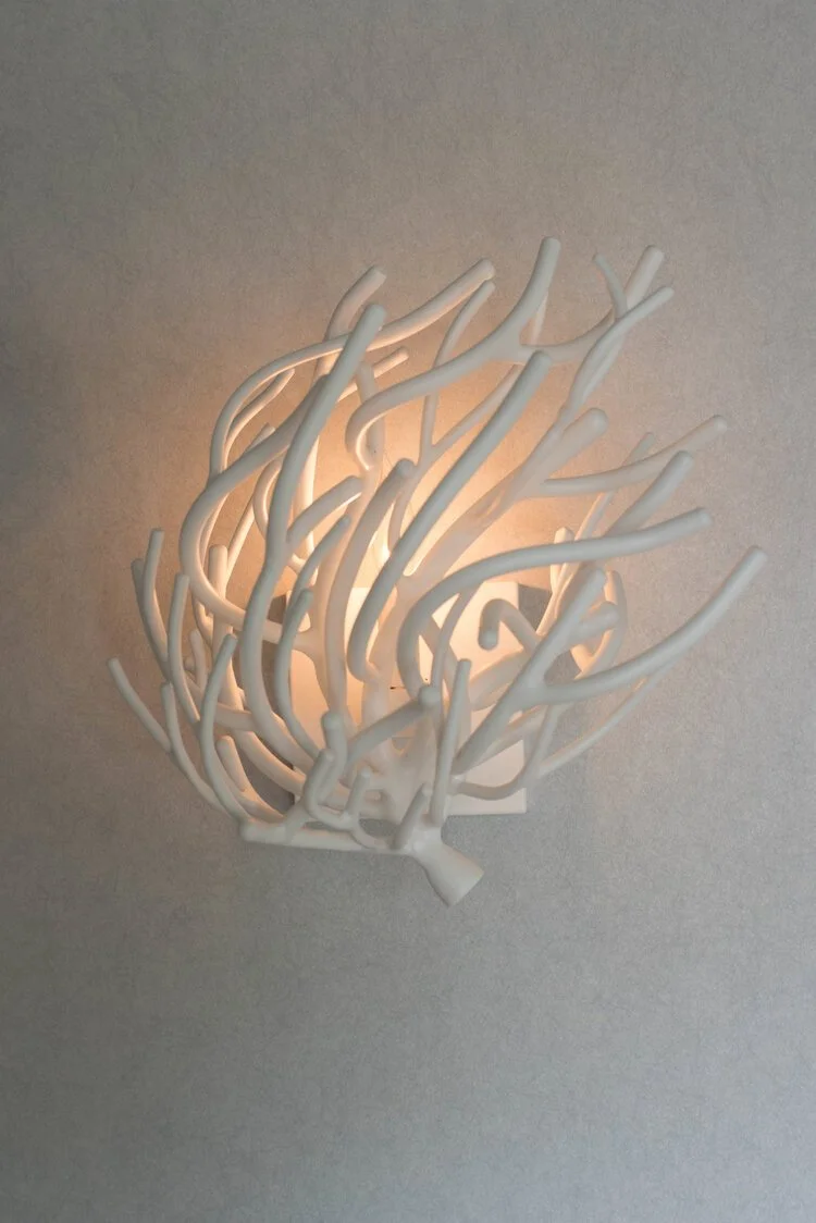 Photo by: Steven Dewall
Delicate coral inspired wall sconces provide soft ambient light. 