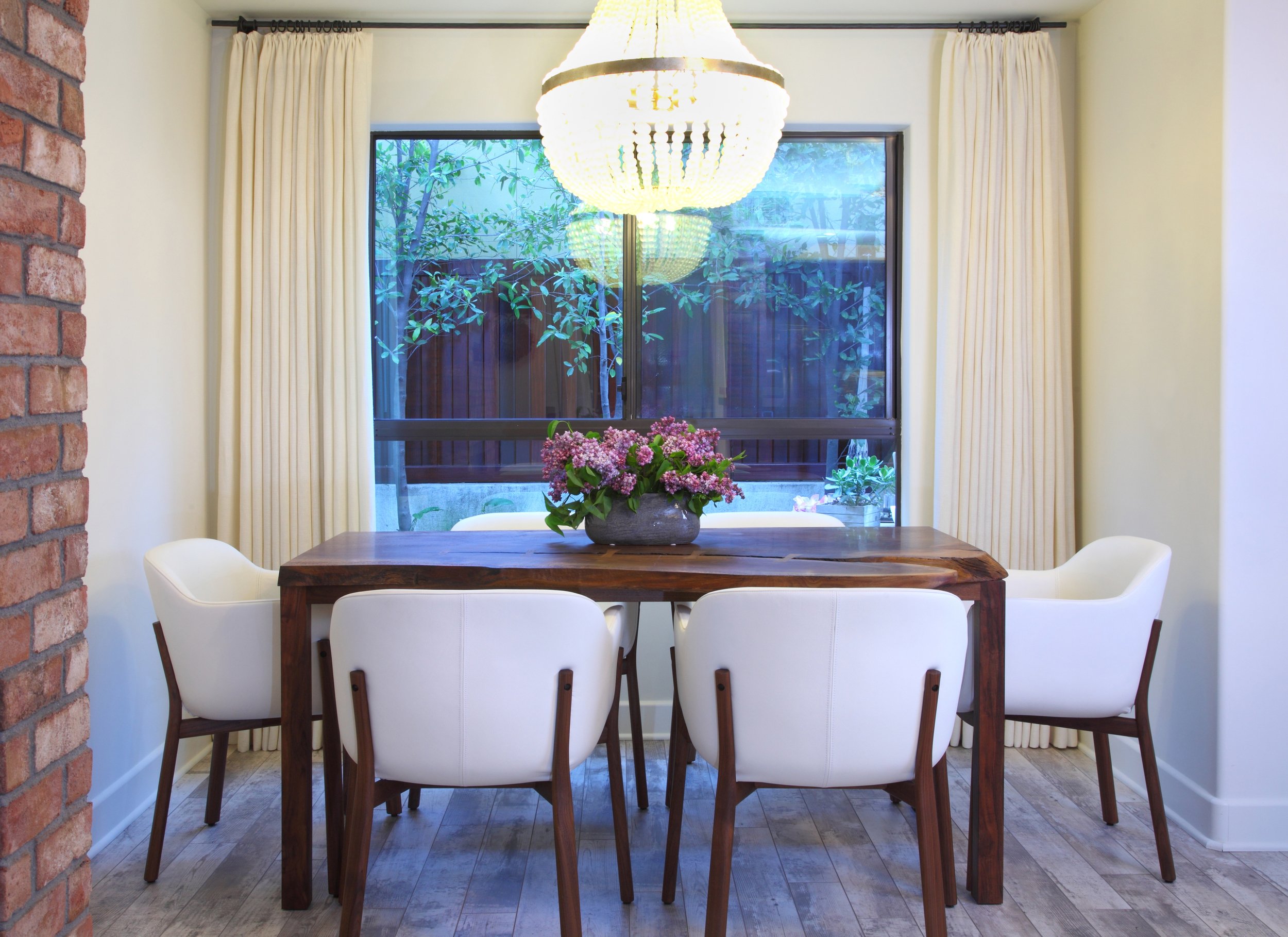 Photo by: Chas Metivier
Handmade walnut chairs are outfitted with white leather for a fresh and timeless aesthetic.